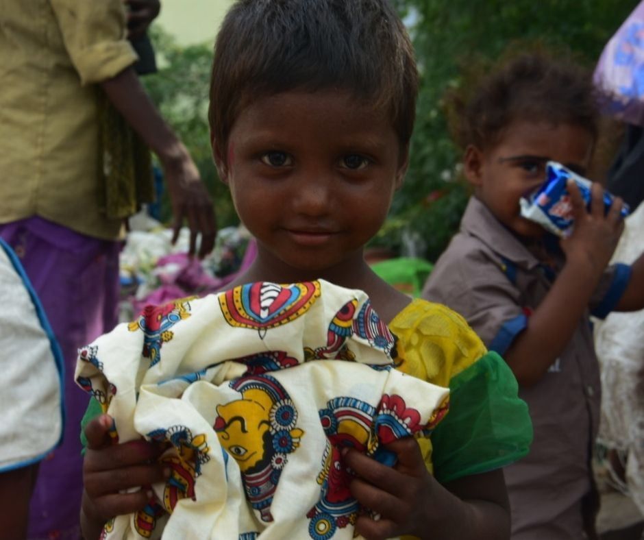 A child with a new dress gifted by Team Everest donors for Diwali