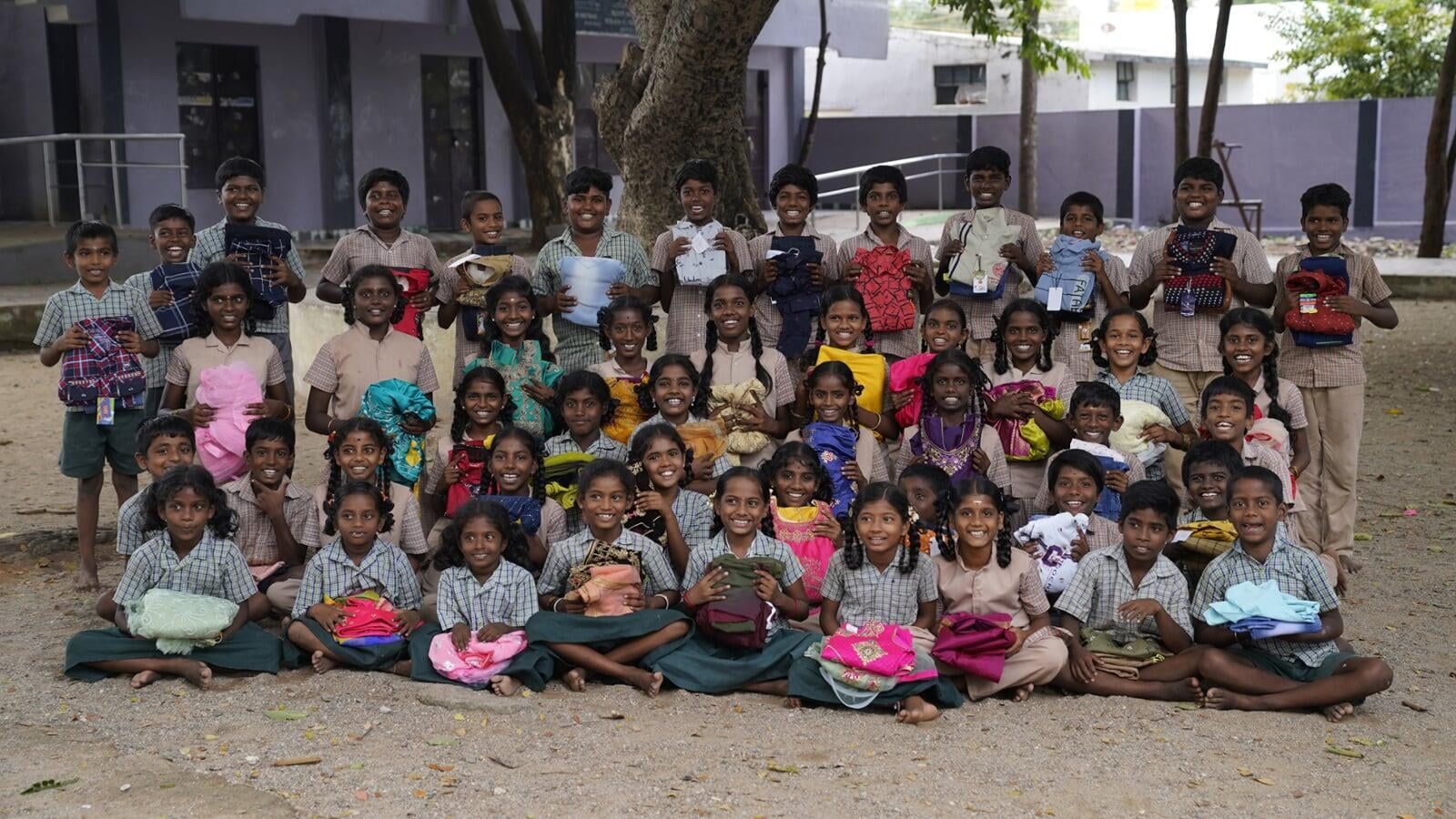 A large group of children are posing for a picture