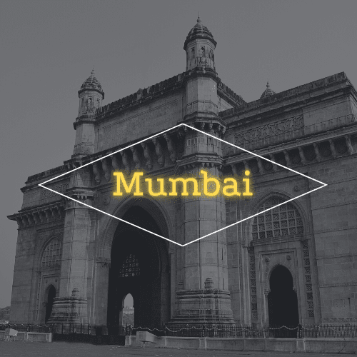 A black and white photo of a building with the word mumbai on it