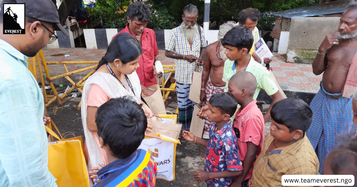 volunteers helping poor people as part of CSR initiative
