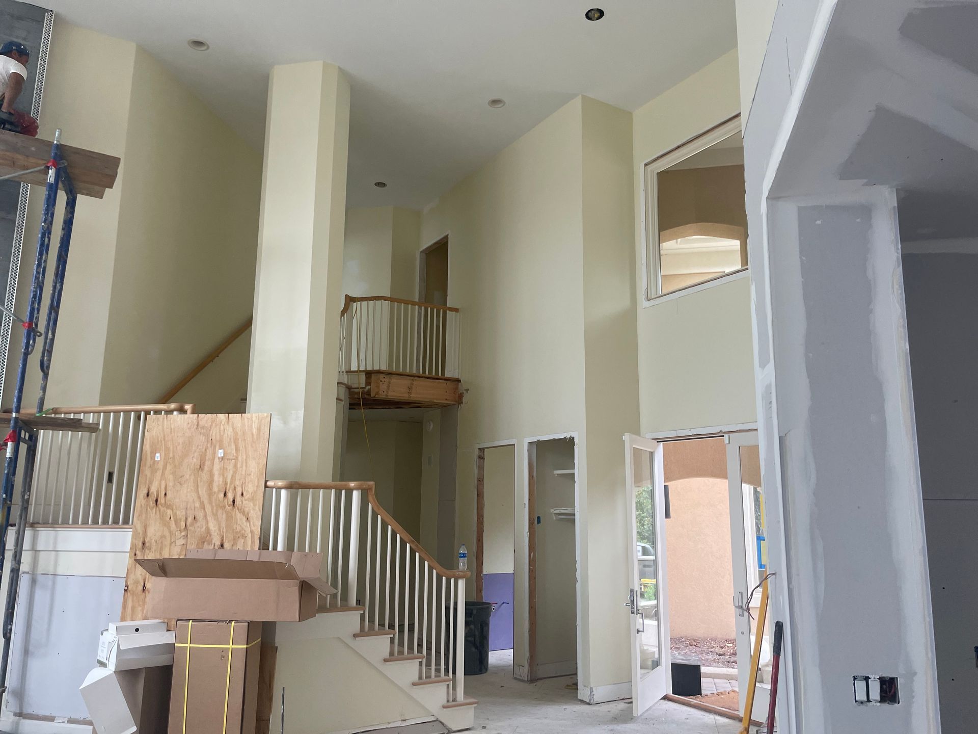 A large room with a staircase in the middle of it