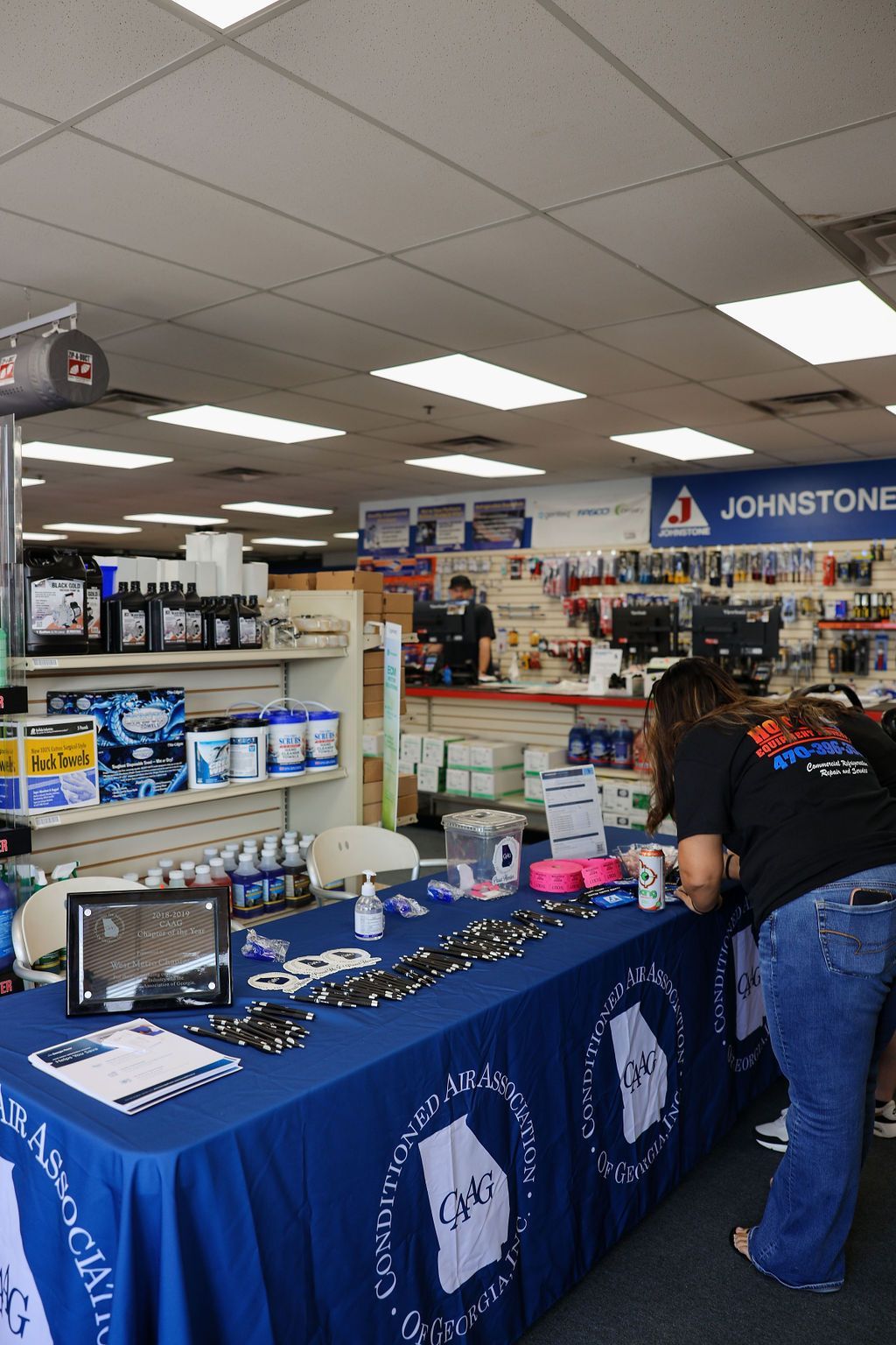 A store with a blue sign that says johnstone