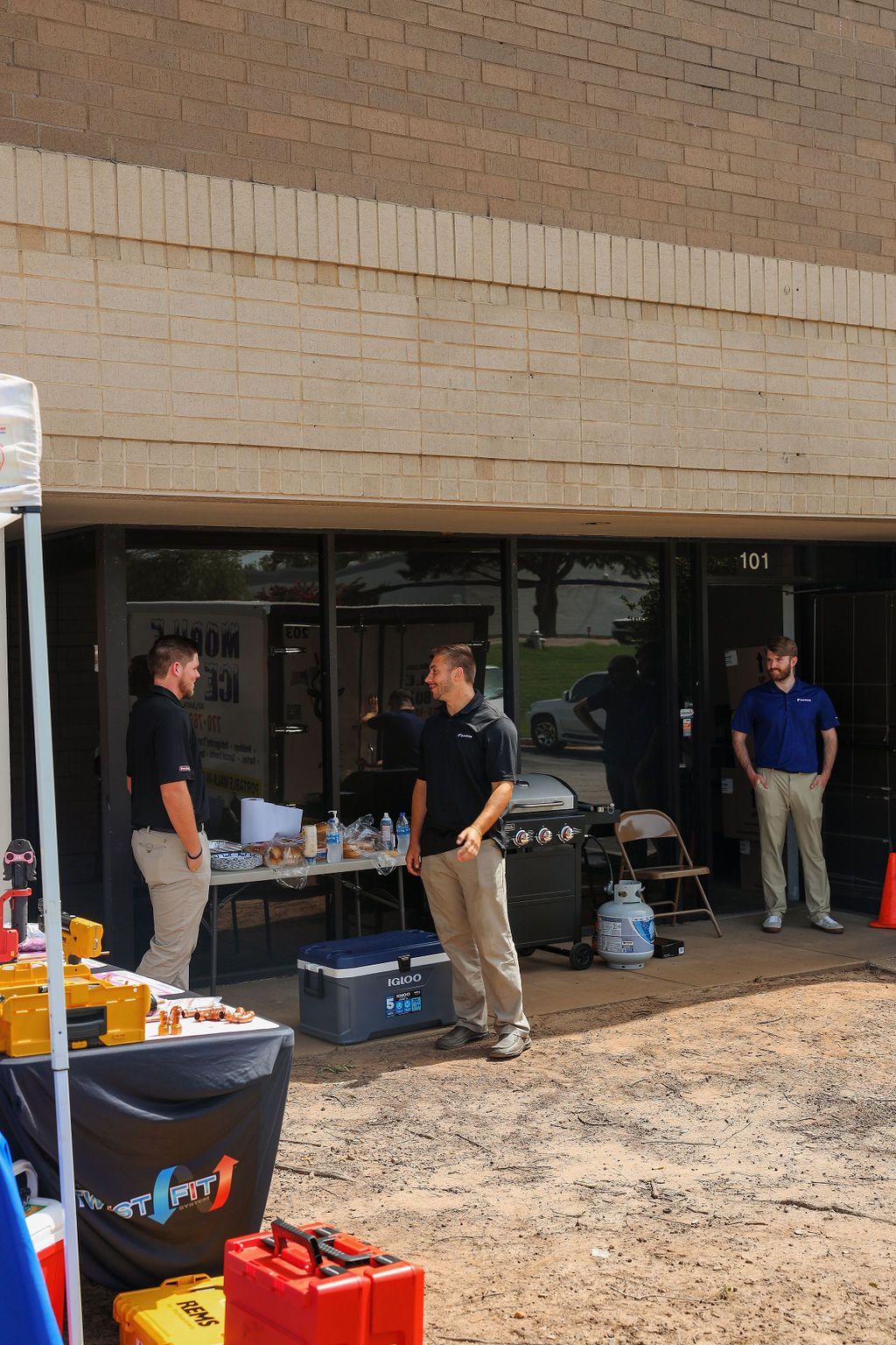 A group of men are standing outside of a building