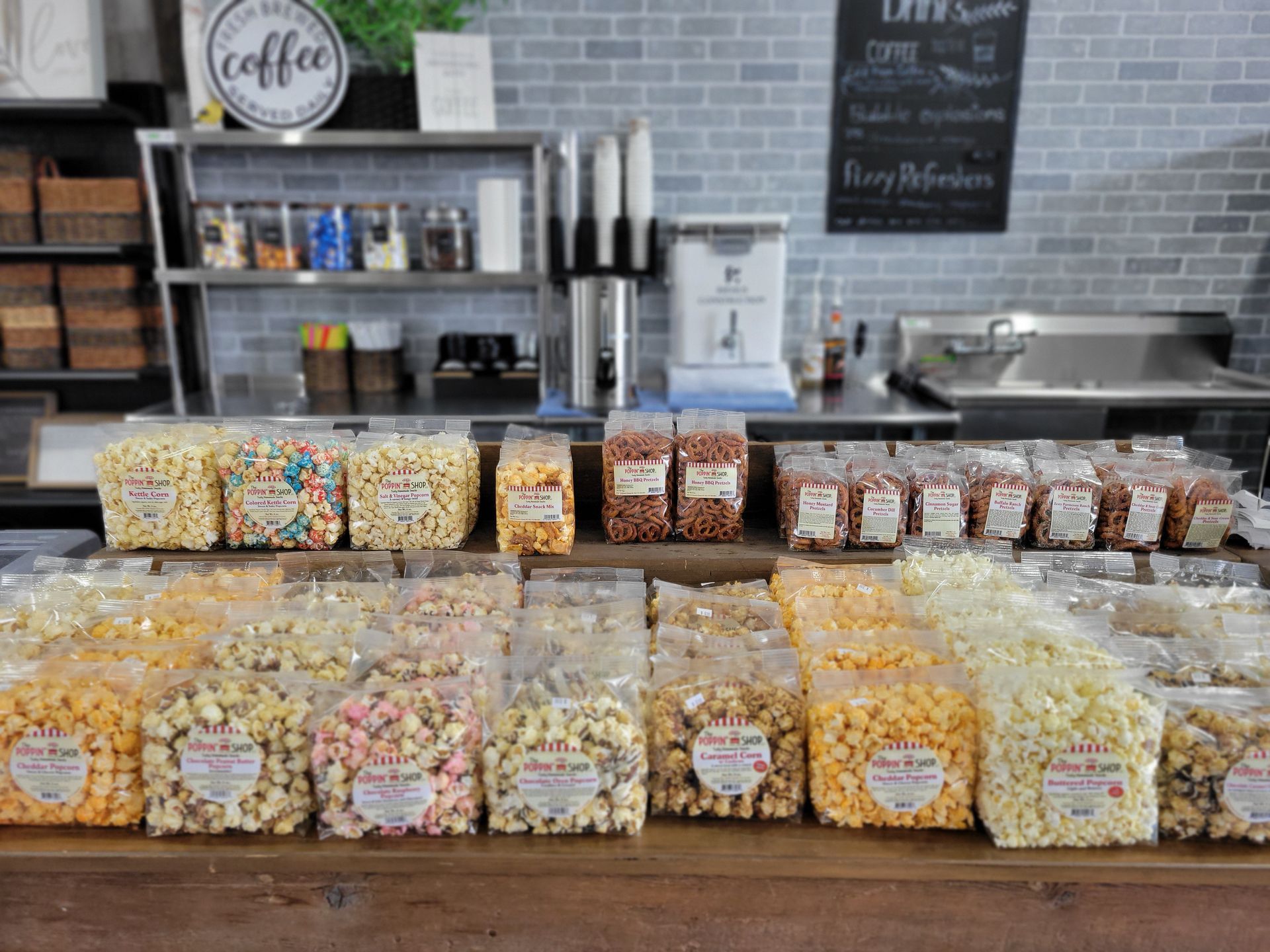 A shelf filled with jars of jam and pickles