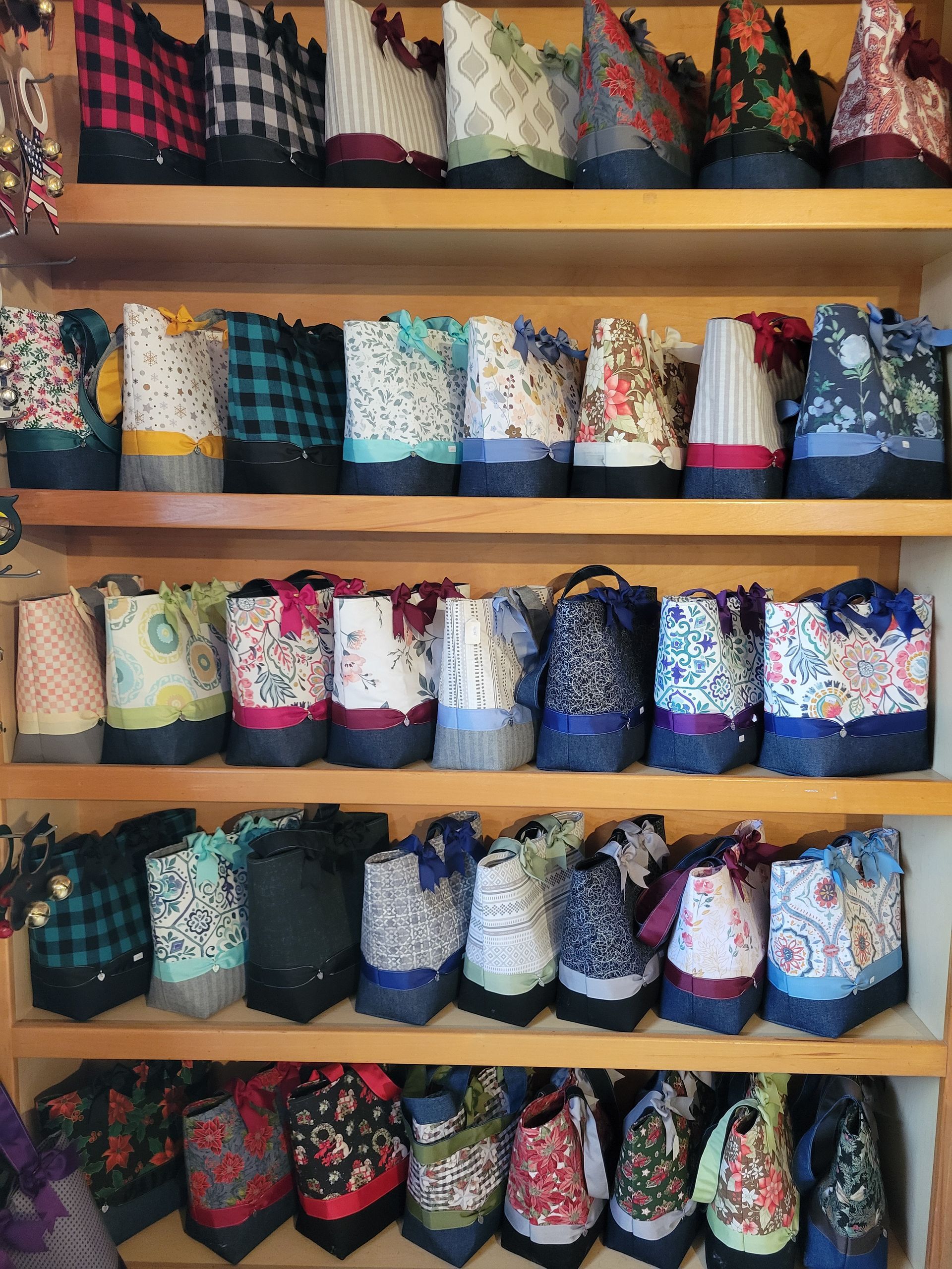 A shelf filled with lots of different colored bags
