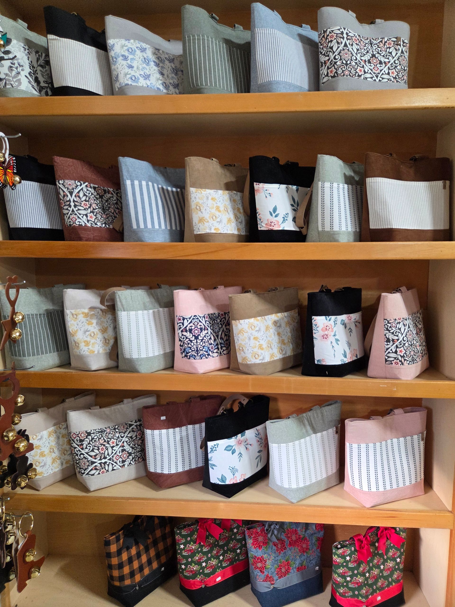 A shelf filled with lots of different colored bags