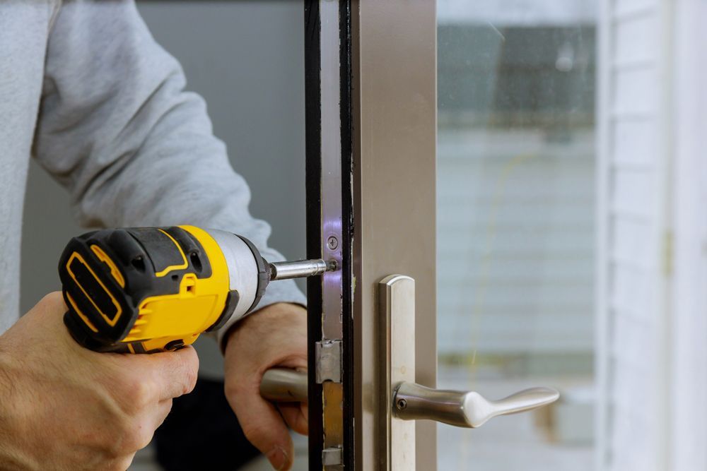 Locksmith Hand Holds the Screwdriver — Cairns, QLD — Guardian Lock Services