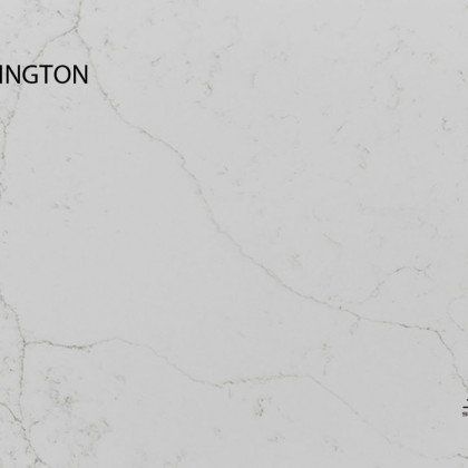 A close up of a white marble counter top with the word washington on it.