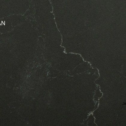 A close up of a black granite counter top