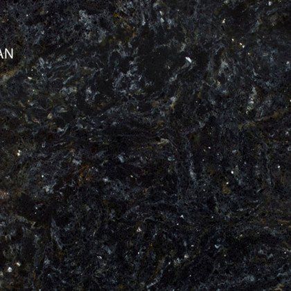 A close up of a black granite counter top
