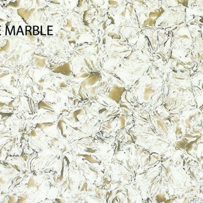 A close up of a white and gold marble counter top.