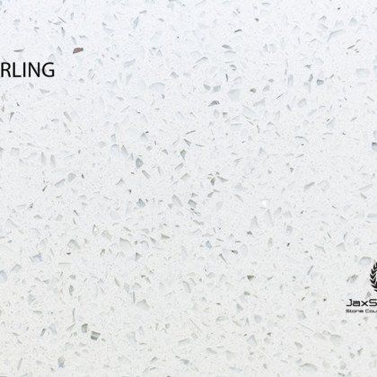 A close up of a white granite counter top.