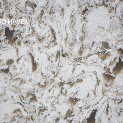 A close up of a white and brown granite counter top
