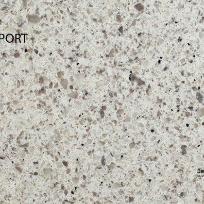 A close up of a white granite counter top.