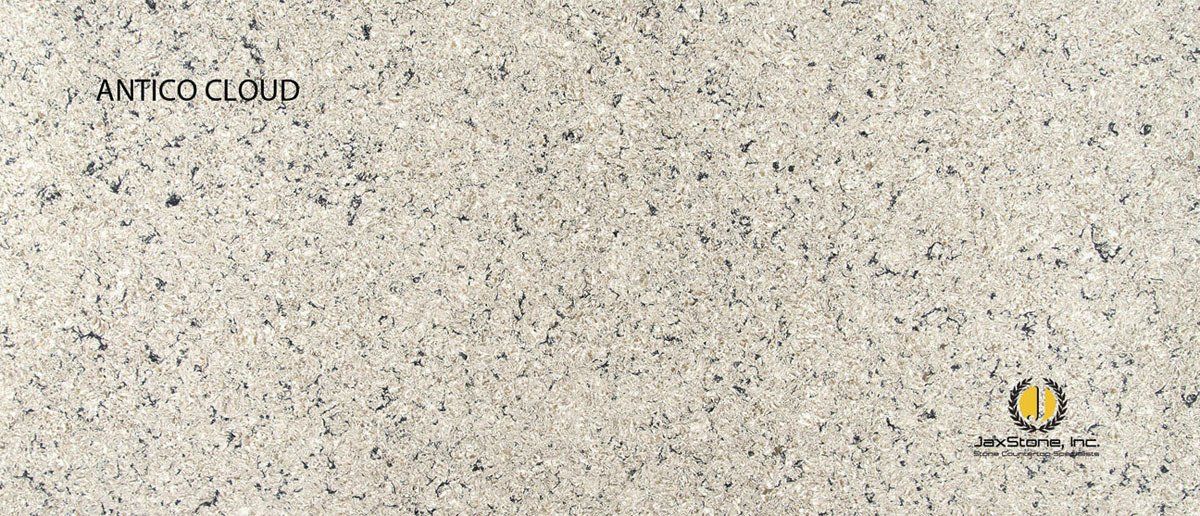 A close up of a white granite counter top.