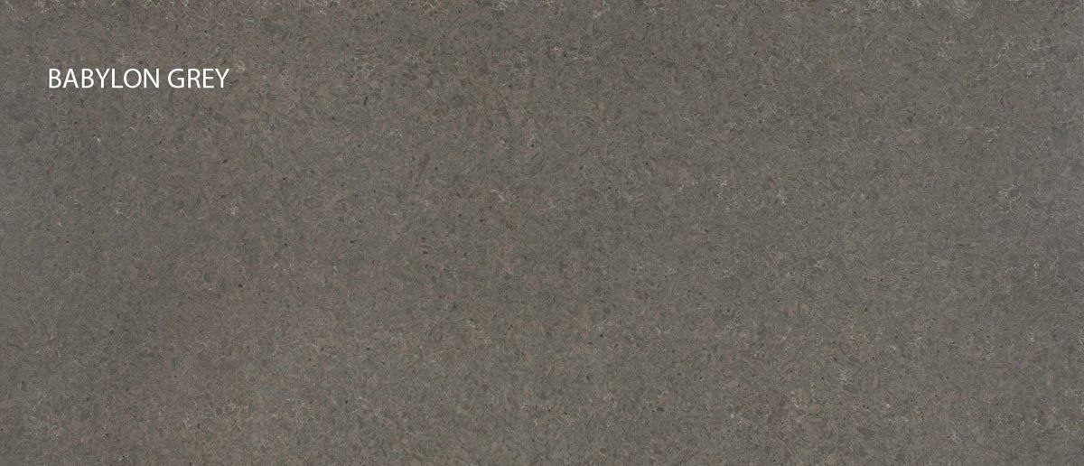 A close up of a gray carpet with the words babylon grey written on it.