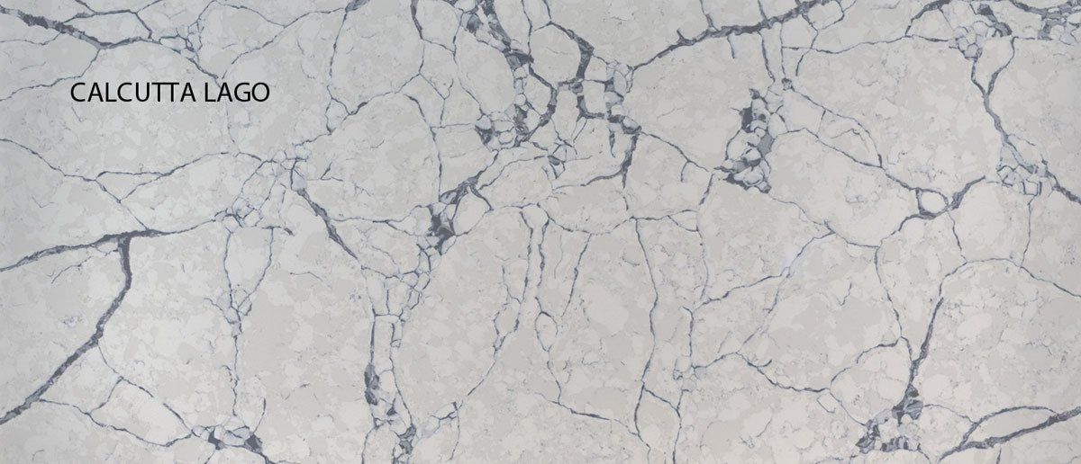 A close up of a white marble counter top with a cracked pattern.