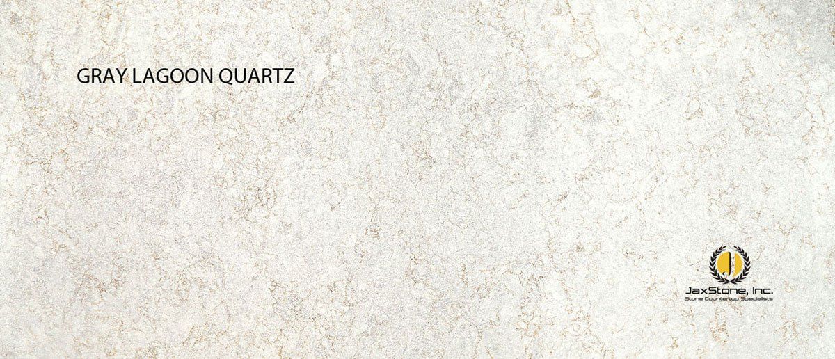 A close up of a gray lagoon quartz counter top.