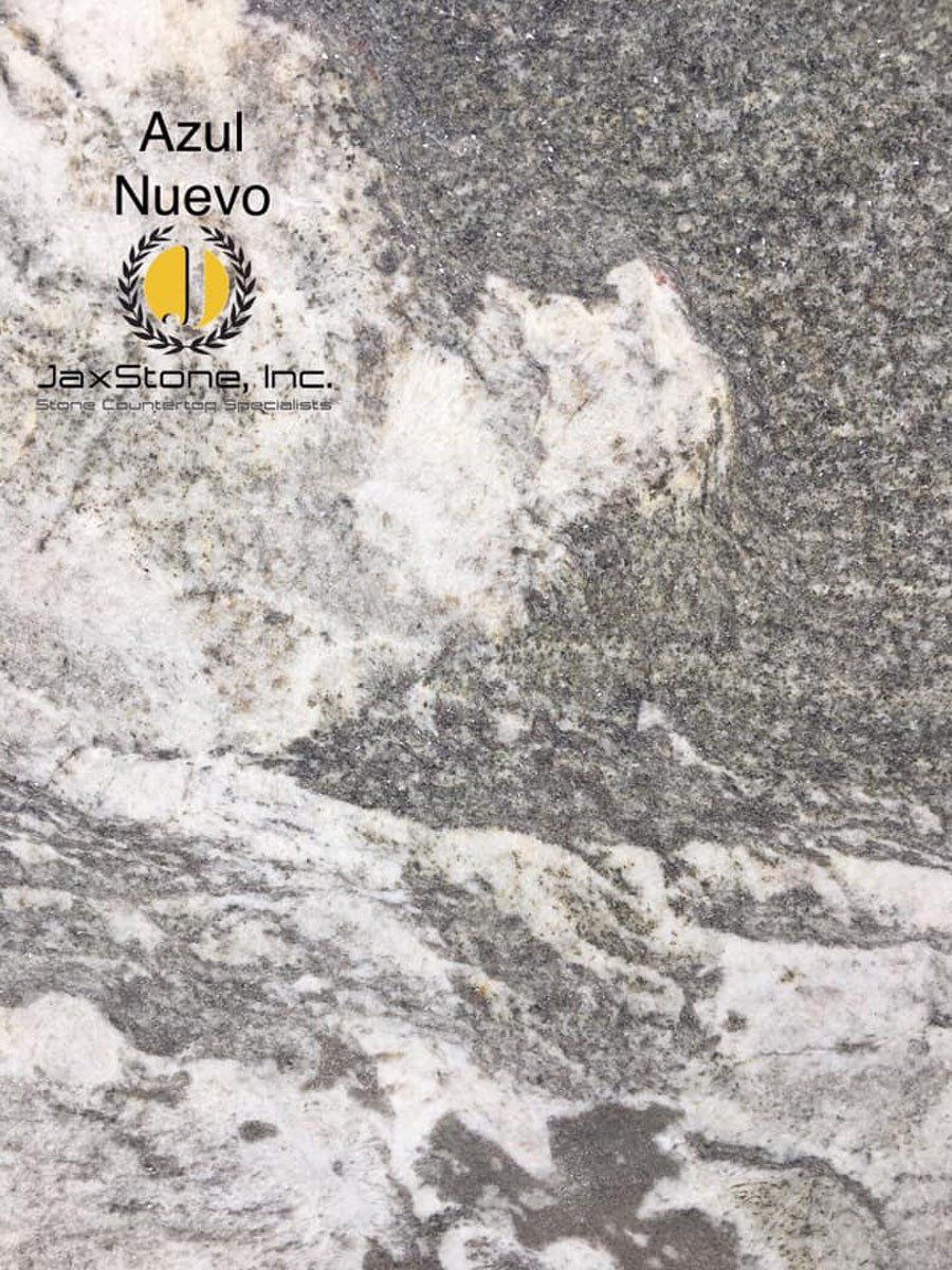 A close up of a marble counter top that says azul nuevo