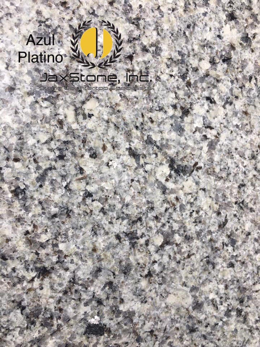 A close up of a granite counter top with a logo on it.