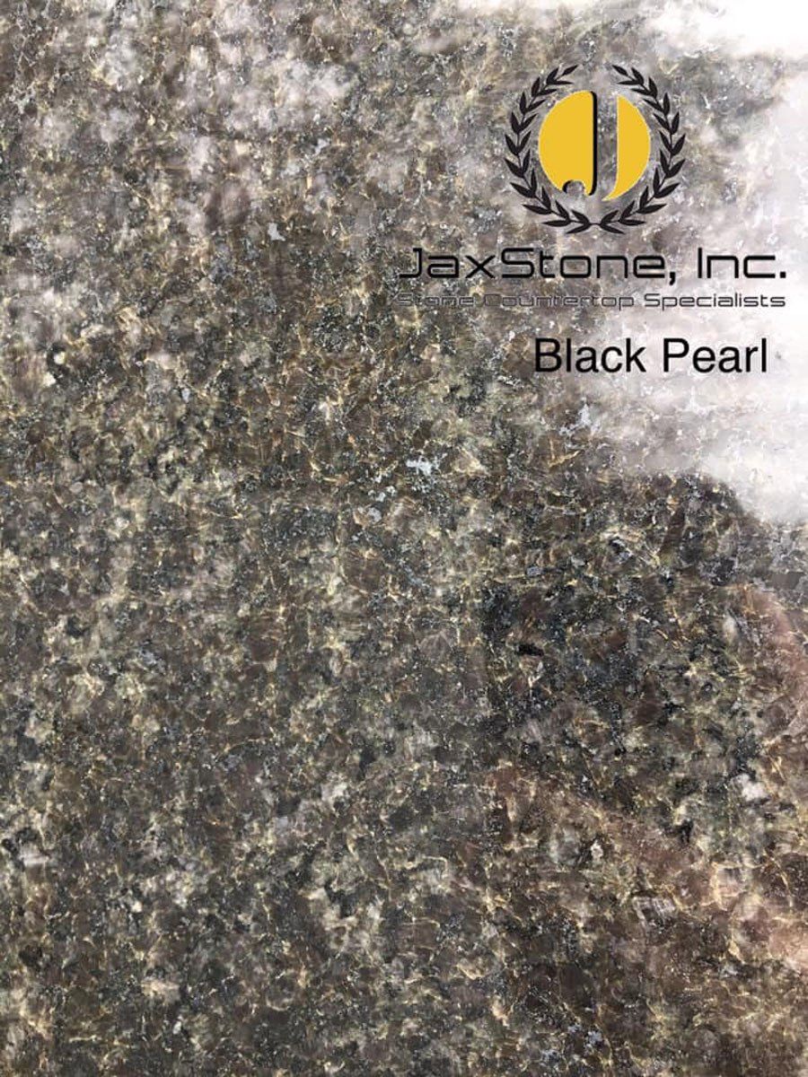 A close up of a black pearl granite counter top.