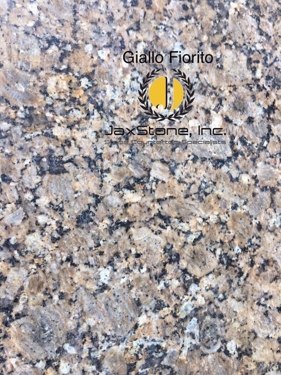 A close up of a granite counter top with a logo on it.