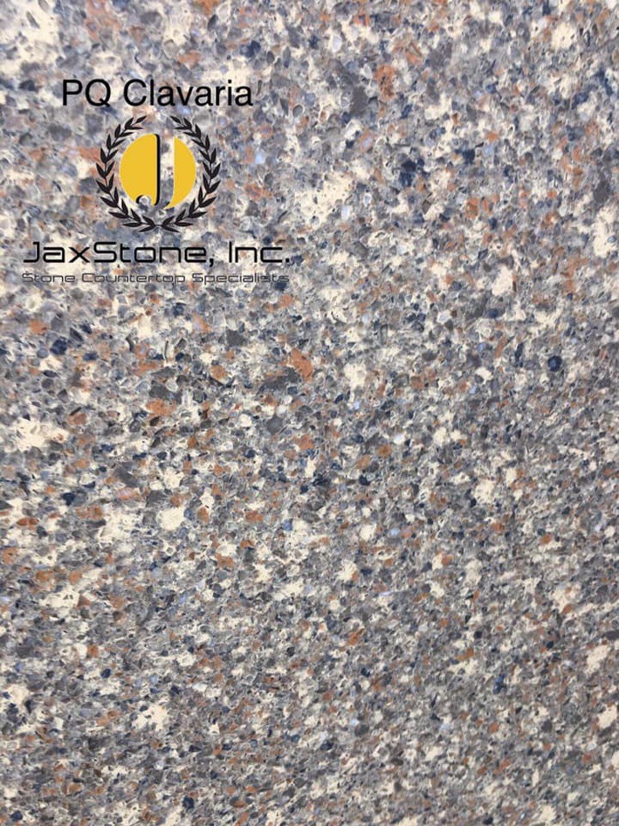 A close up of a gray and white granite counter top