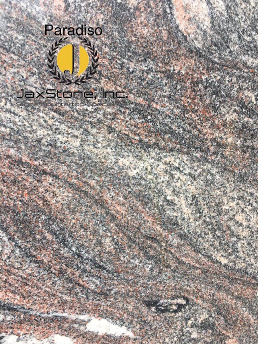 A close up of a granite counter top with a logo on it.