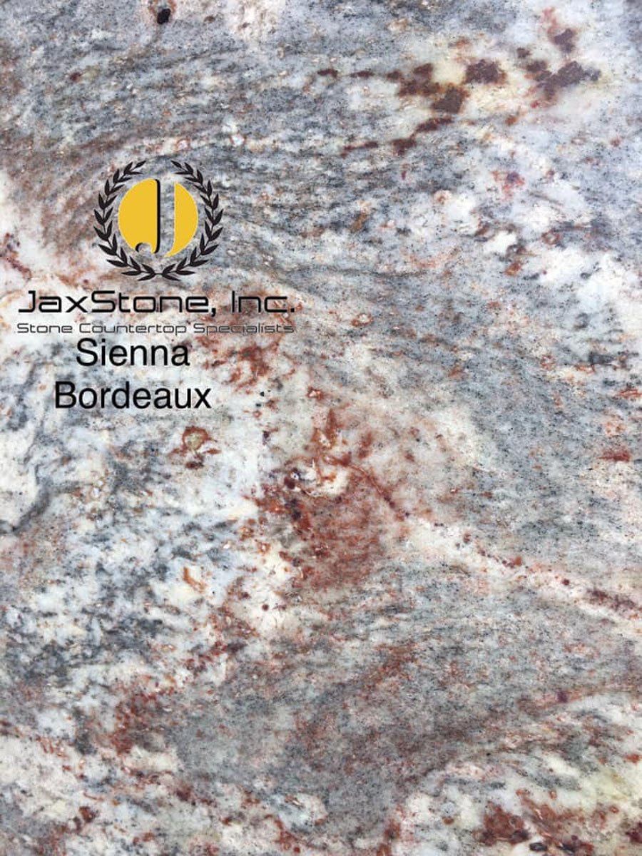 A close up of a granite counter top in bordeaux.