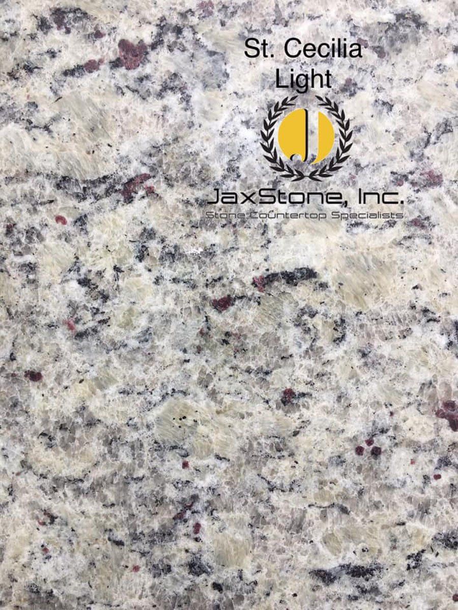 A close up of a granite counter top with a logo on it.