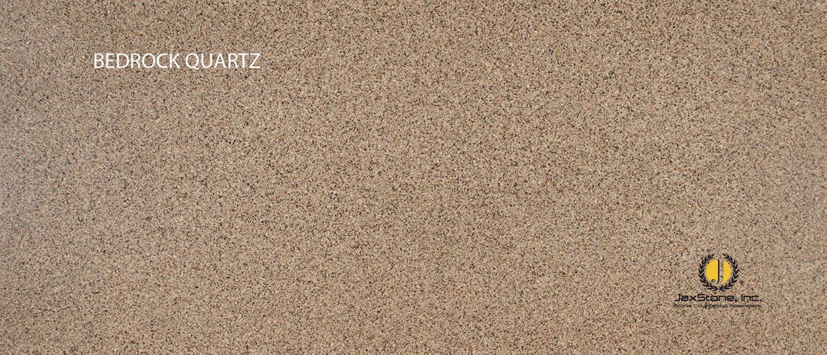 A close up of a brown carpet with a yellow logo on it.