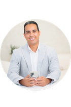 Black and white logo: "TOHO" text below a house outline, "REALTY GROUP" text at the bottom.