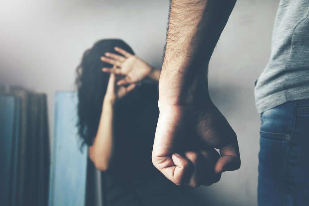 A man and a woman are fighting