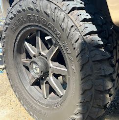 A close up of a tire and wheel on a truck.