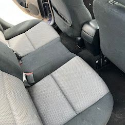 A close up of the back seat of a car.