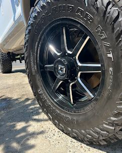 A close up of a tire and wheel on a truck.