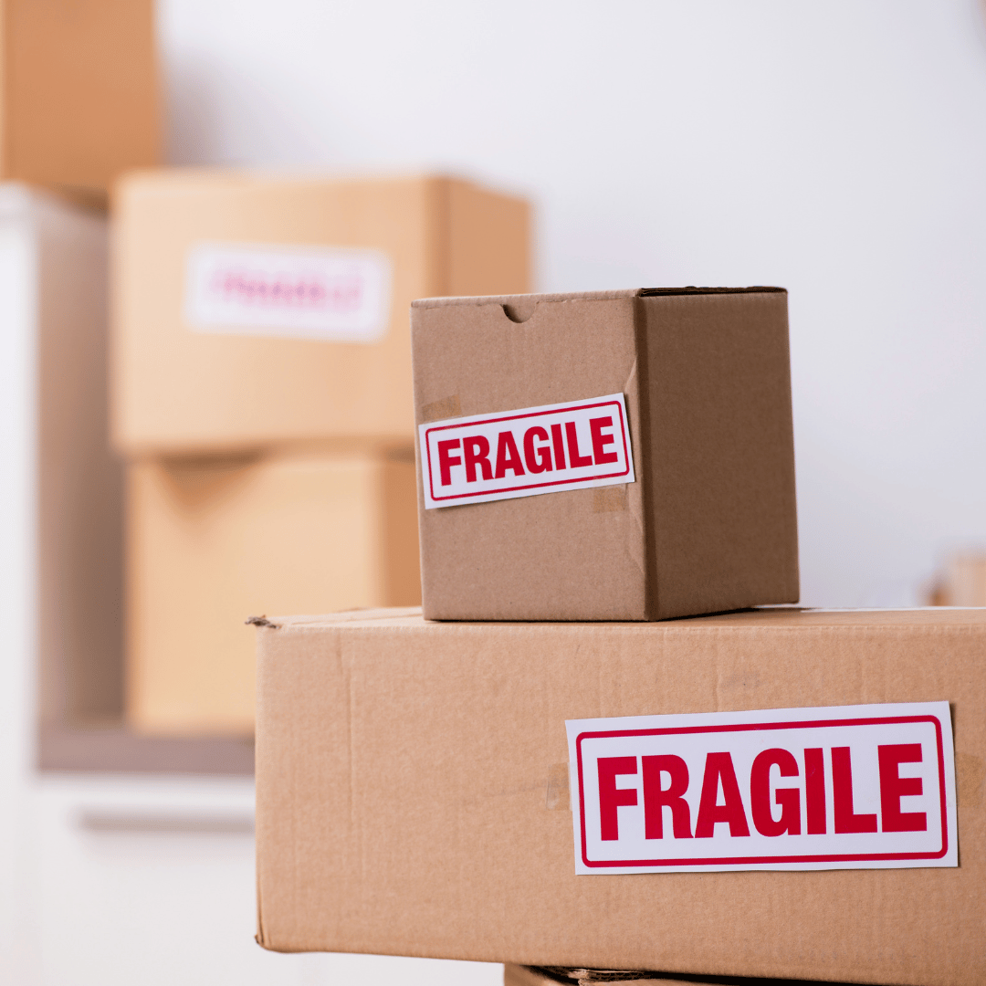 A cardboard box with a fragile sticker on it