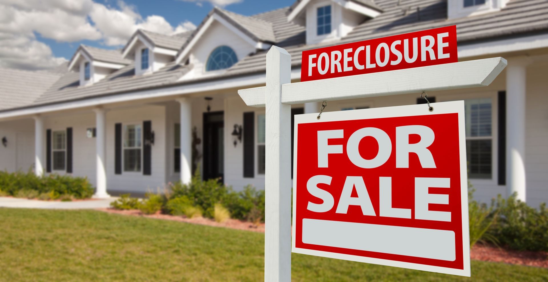 Happy homeowners showing their property – For Sale By Owner process in action