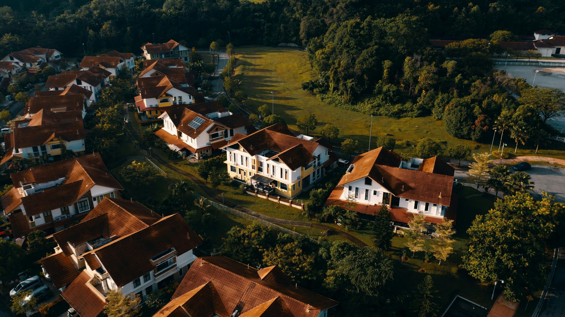 Happy homeowners showing their property – For Sale By Owner process in action