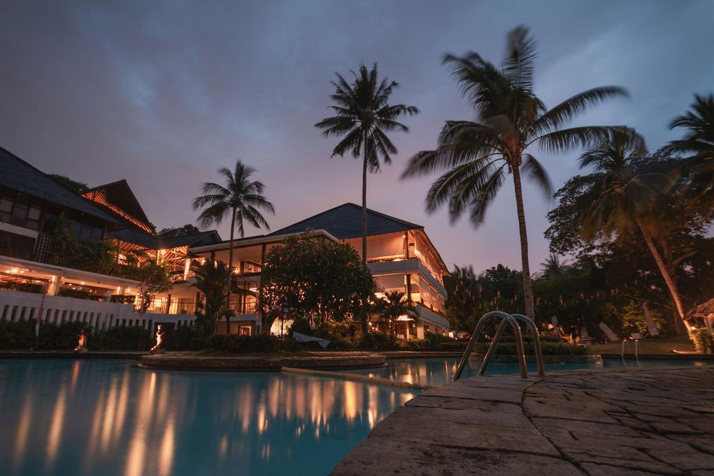Tropical-style estate at dusk – luxury living with resort-style amenities