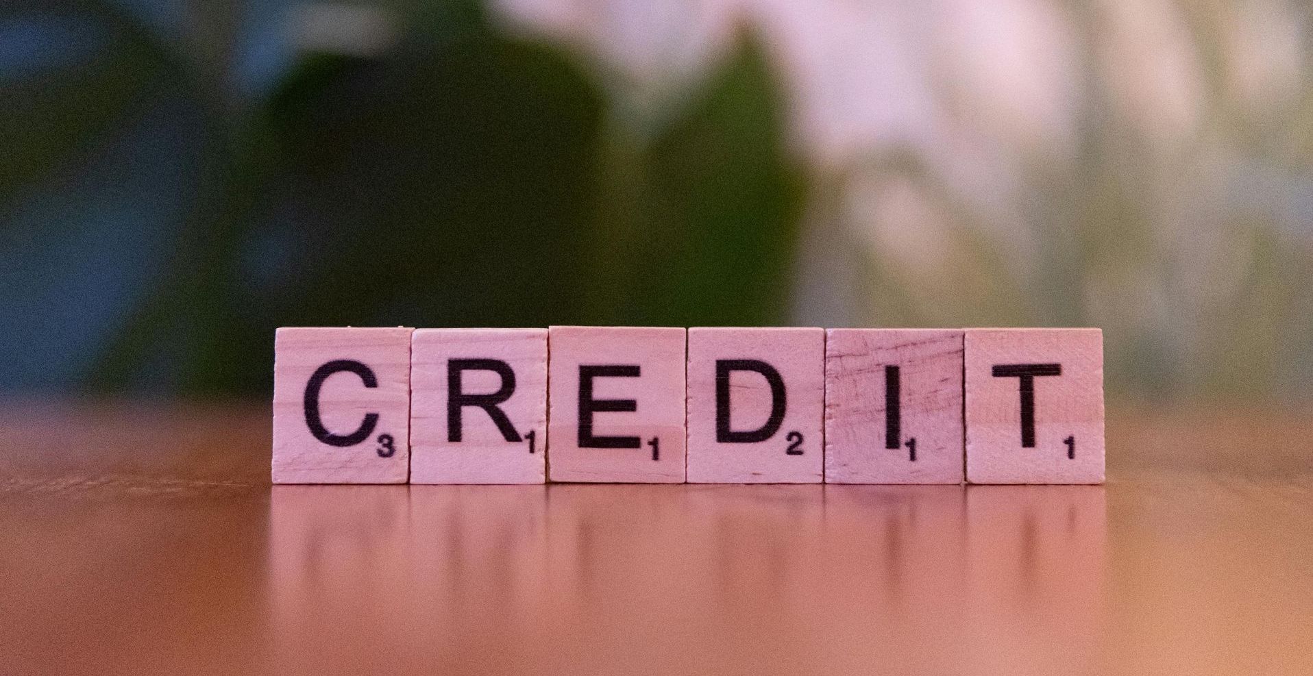 Wooden tiles spelling credit – understanding FICO® scores and their impact on loans