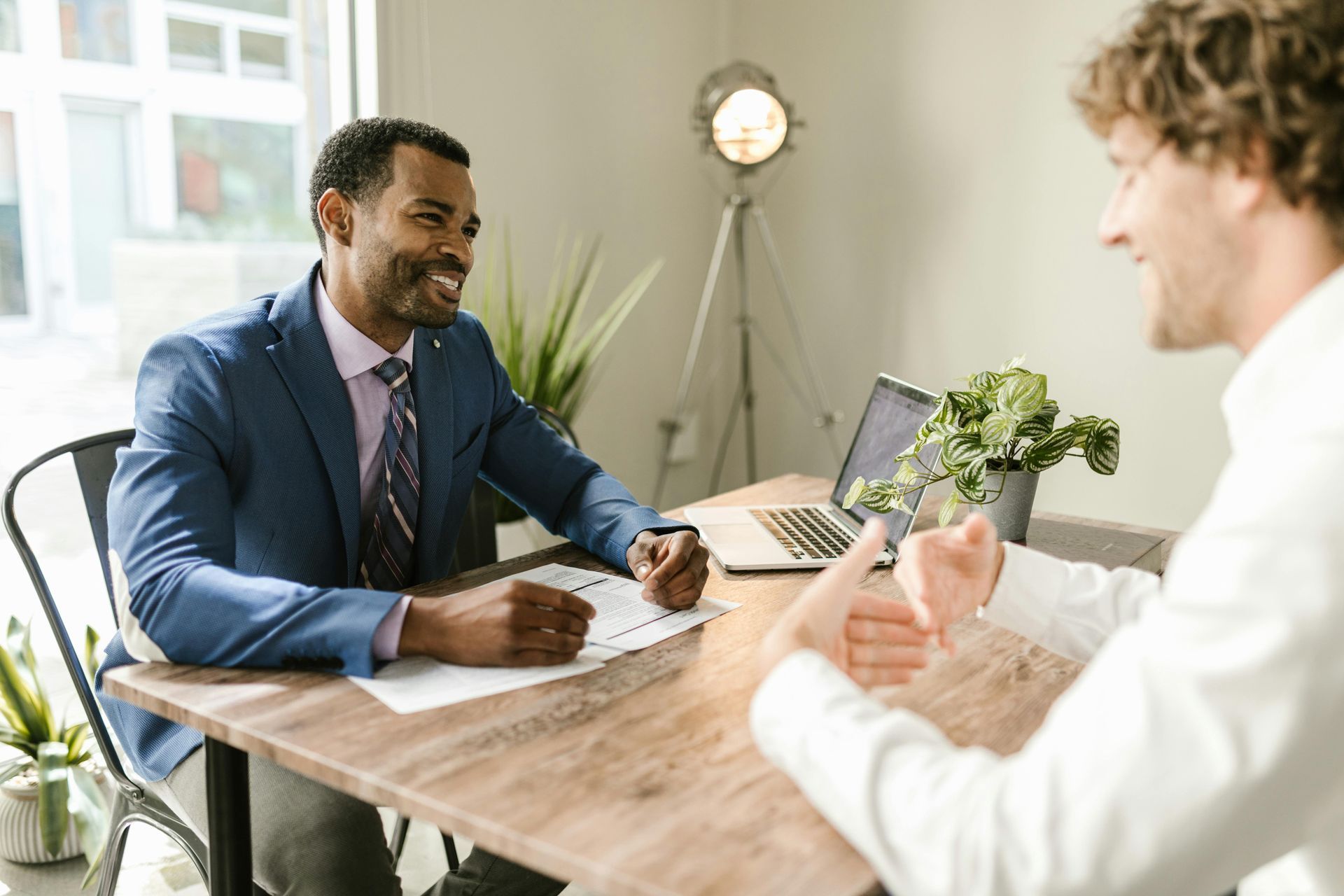 Professional meeting with a client – discussing refinancing options for home loans