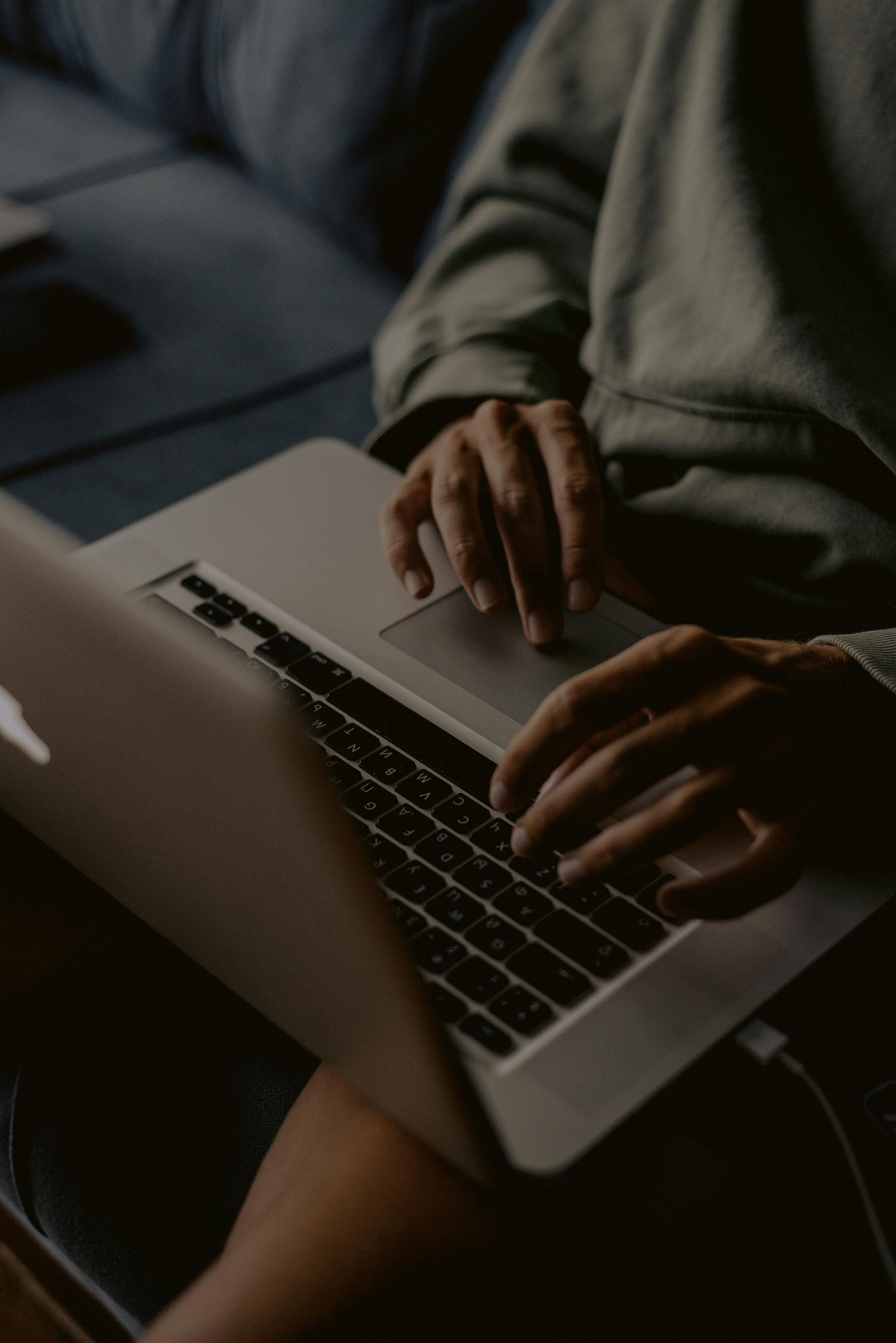 Typing on laptop – researching how to find a trustworthy mortgage lender