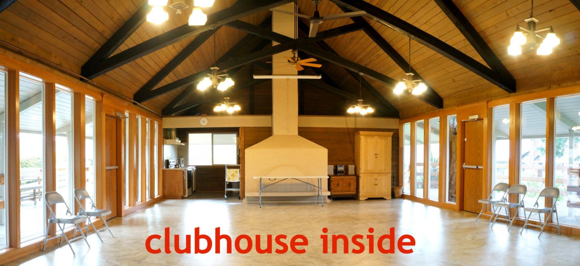 A large room with the words clubhouse inside on the bottom