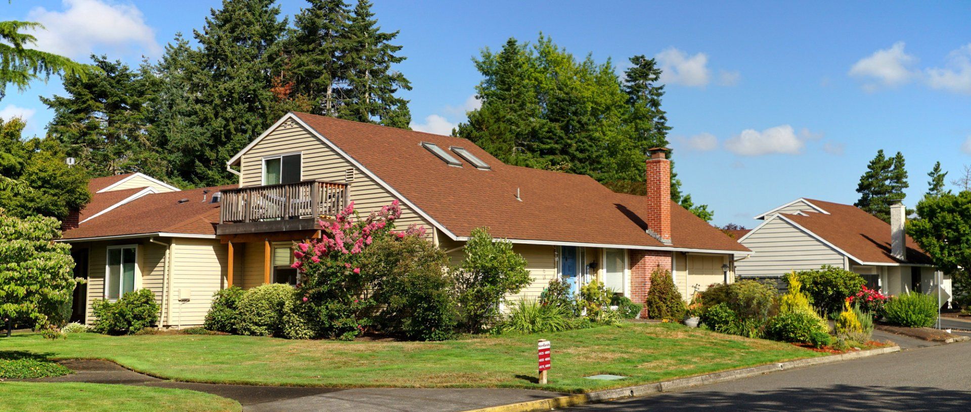 A house with a brown roof and a fire hydrant in front of it