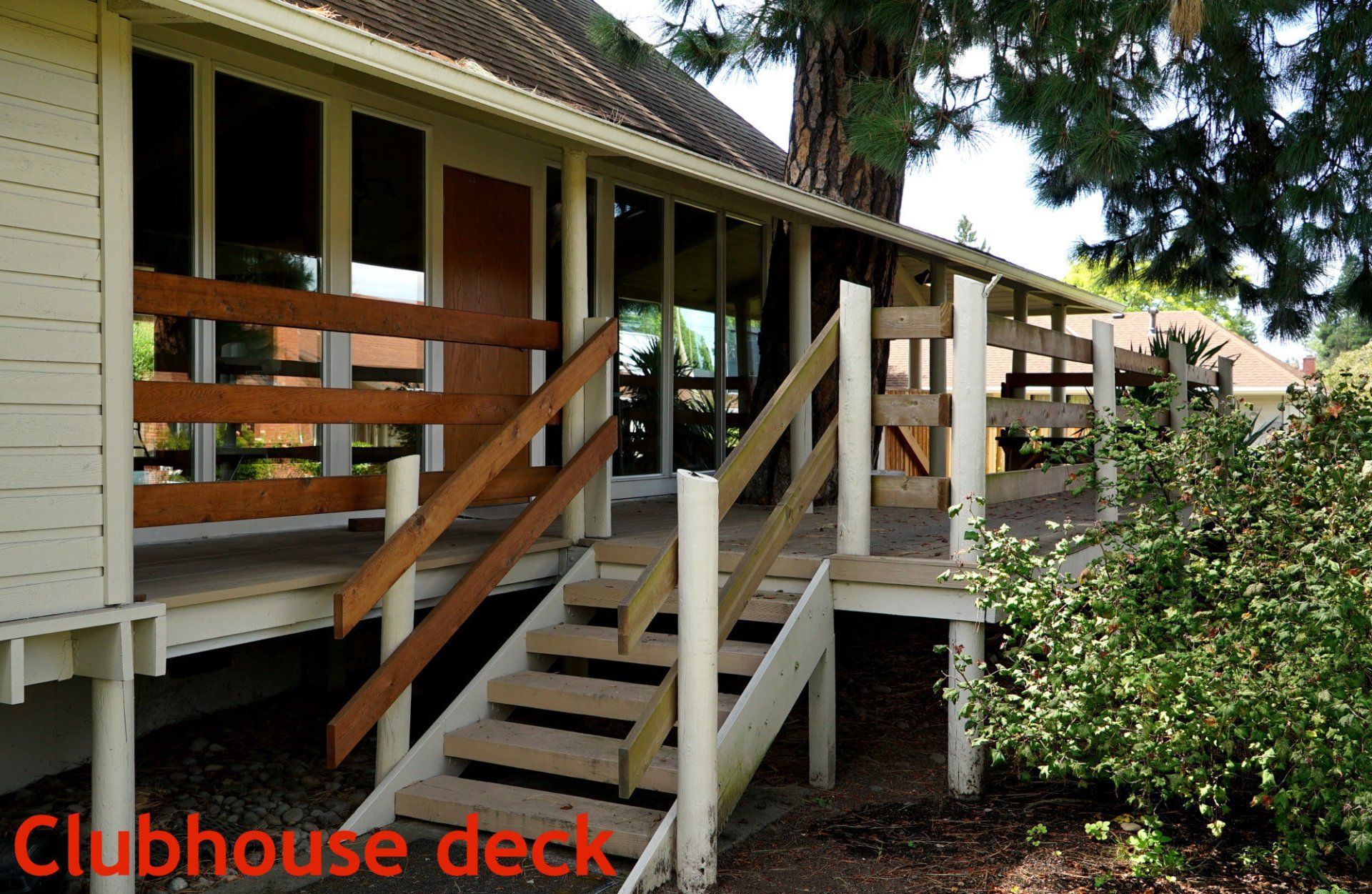 A clubhouse deck with stairs leading up to it
