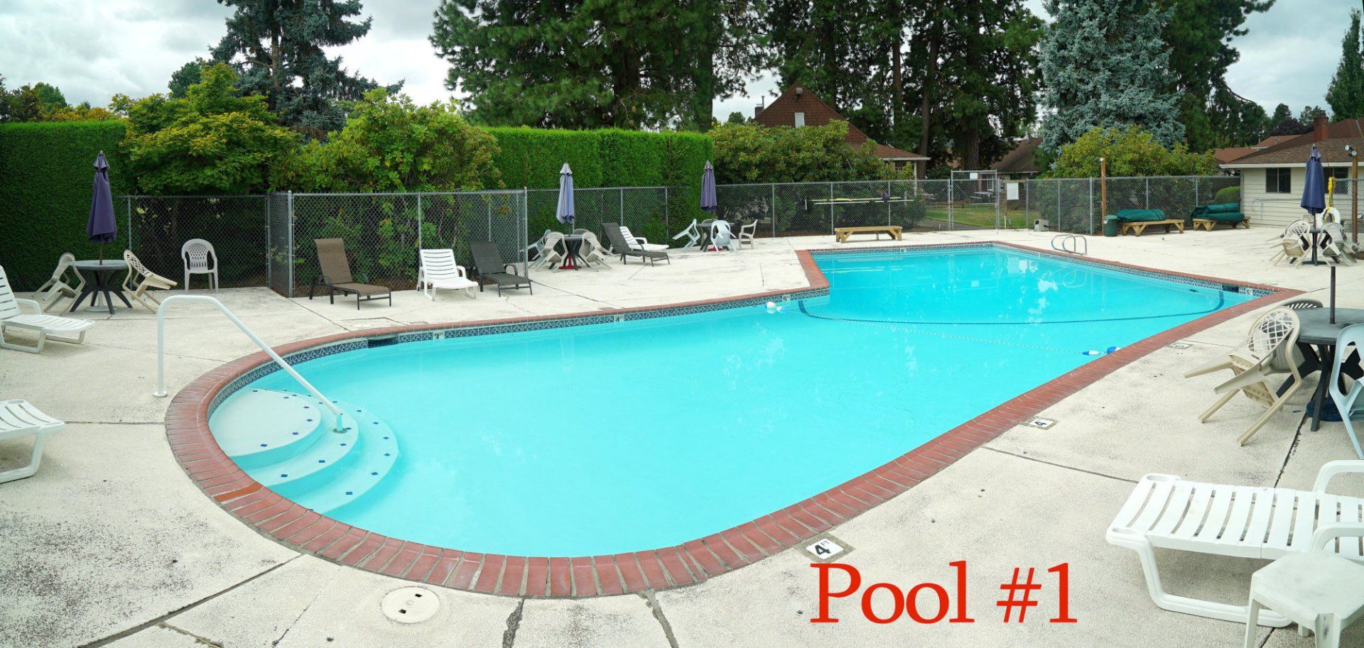 A large swimming pool with the words pool # 1 below it