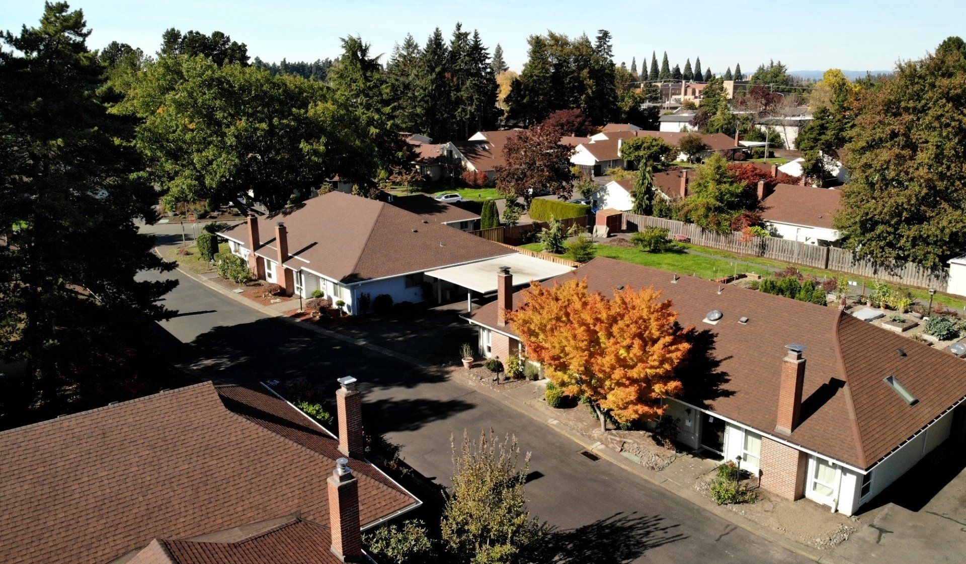 An aerial view of a residential neighborhood with houses and trees
