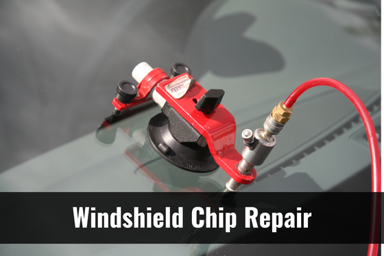 A windshield chip repair machine is being used on a car windshield