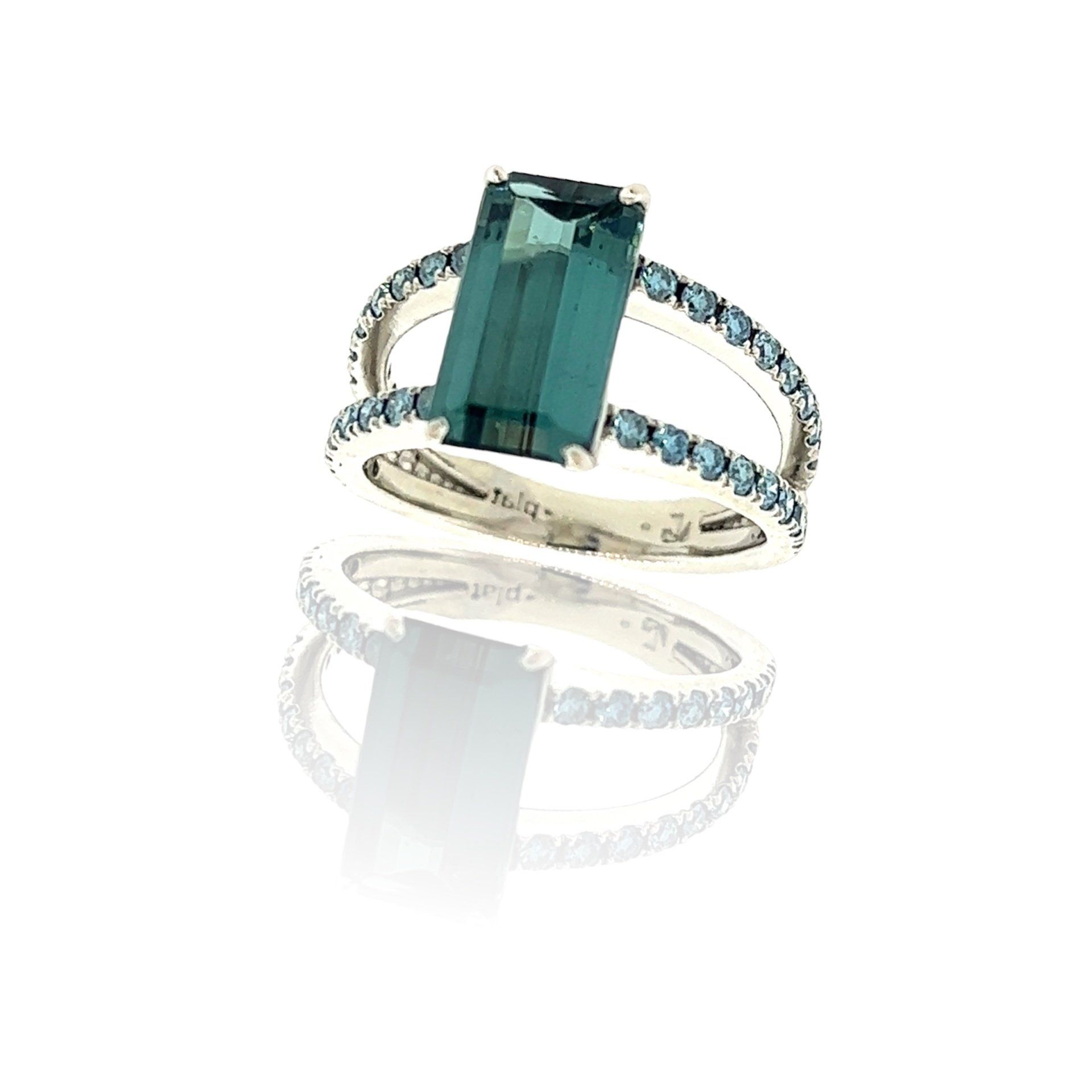 A yellow gold ring with a diamond in the center
